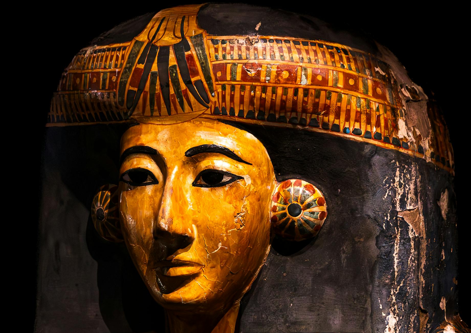 Ancient Egyptian sarcophagus and mummy exhibit in a Cairo museum