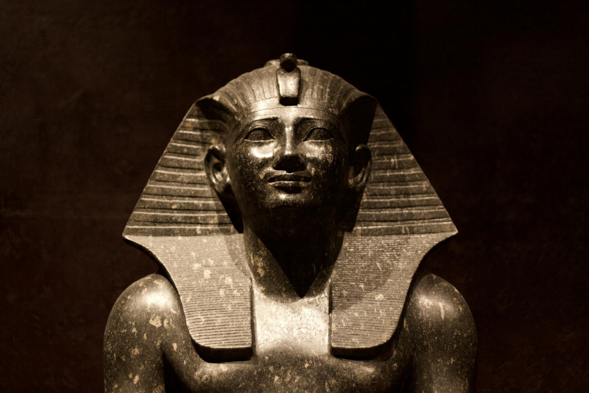Ancient Egyptian pharaoh statue exhibited in a Cairo museum