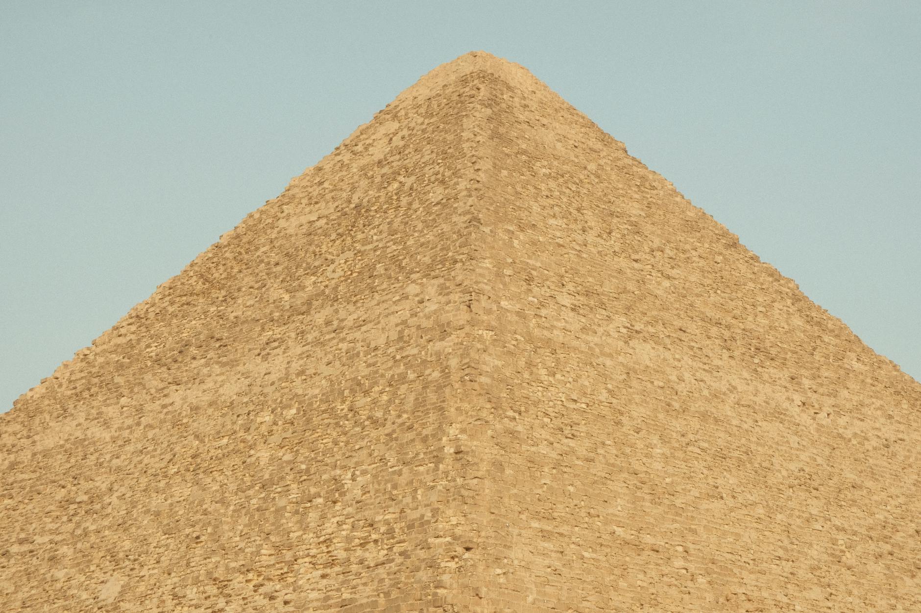 Pyramids of Giza Complete Visitor Guide — History, Tickets, and Tips 4 Close-up view of the Great Pyramid of Khufu showing the massive limestone blocks at Giza