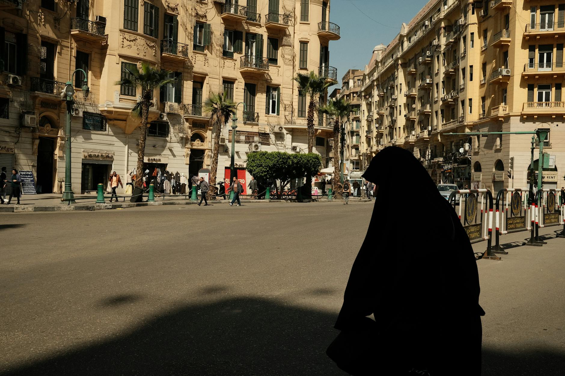 Is Cairo Safe for Tourists? Current Security Guide 2026 4 Cairo safe street busy pedestrians classic architecture tourists