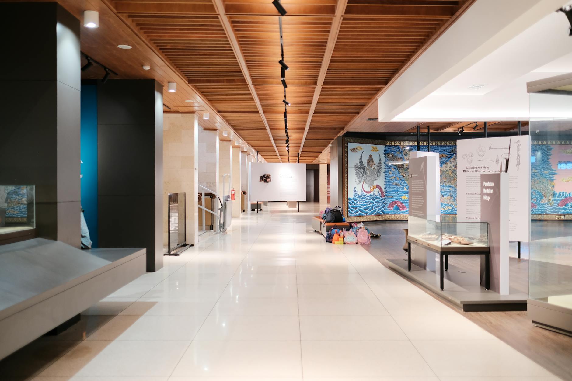 Grand Egyptian Museum vs Egyptian Museum Tahrir: Which Should You Visit? 5 A bright exhibition hallway inside the Egyptian Museum at Tahrir lined with ancient artefacts