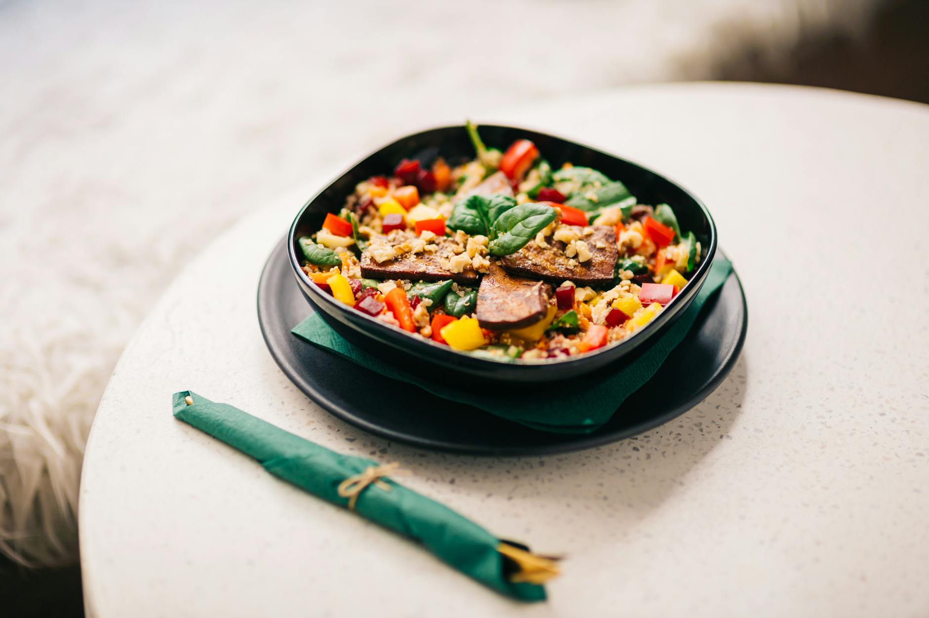 Vegetarian and vegan food in Cairo tofu vegetables black plate plant-based
