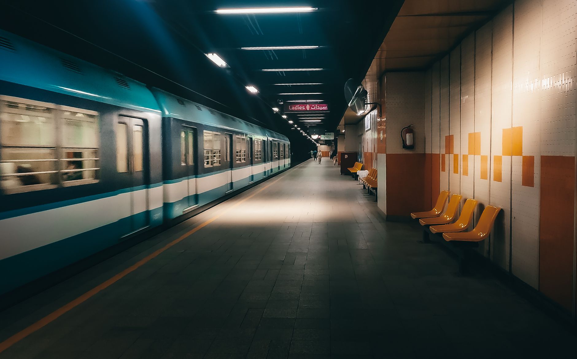 Getting Around Cairo: Transportation Guide 3 Cairo Metro train arriving at an underground station platform in Egypt