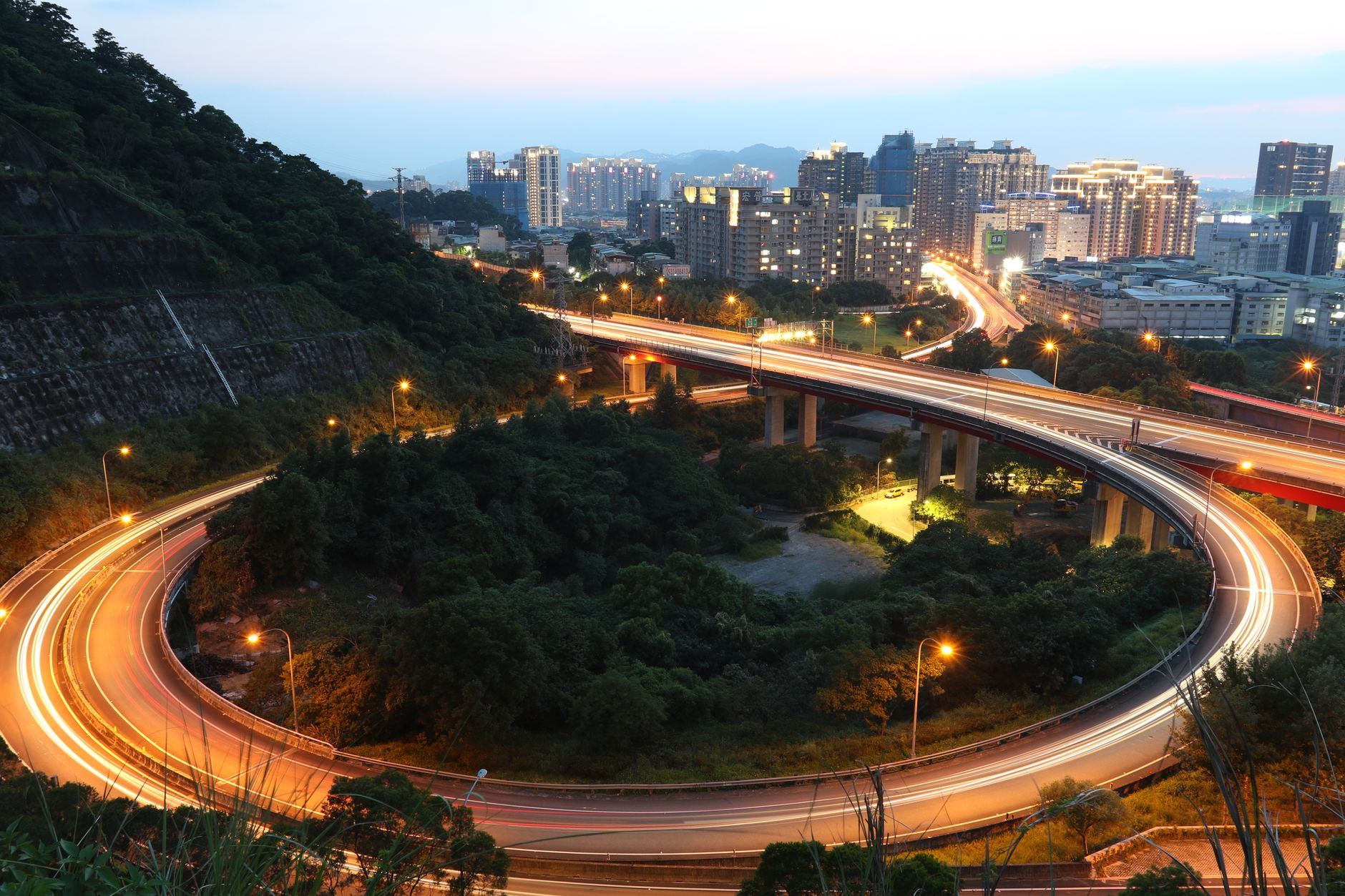 Getting Around Cairo: Transportation Guide 5 Cairo Ring Road flyover and city highway traffic at dusk in Egypt