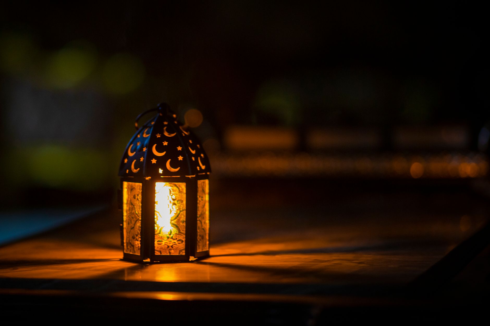 Colorful Ramadan fanous lanterns strung across a street market in Cairo, Egypt at night