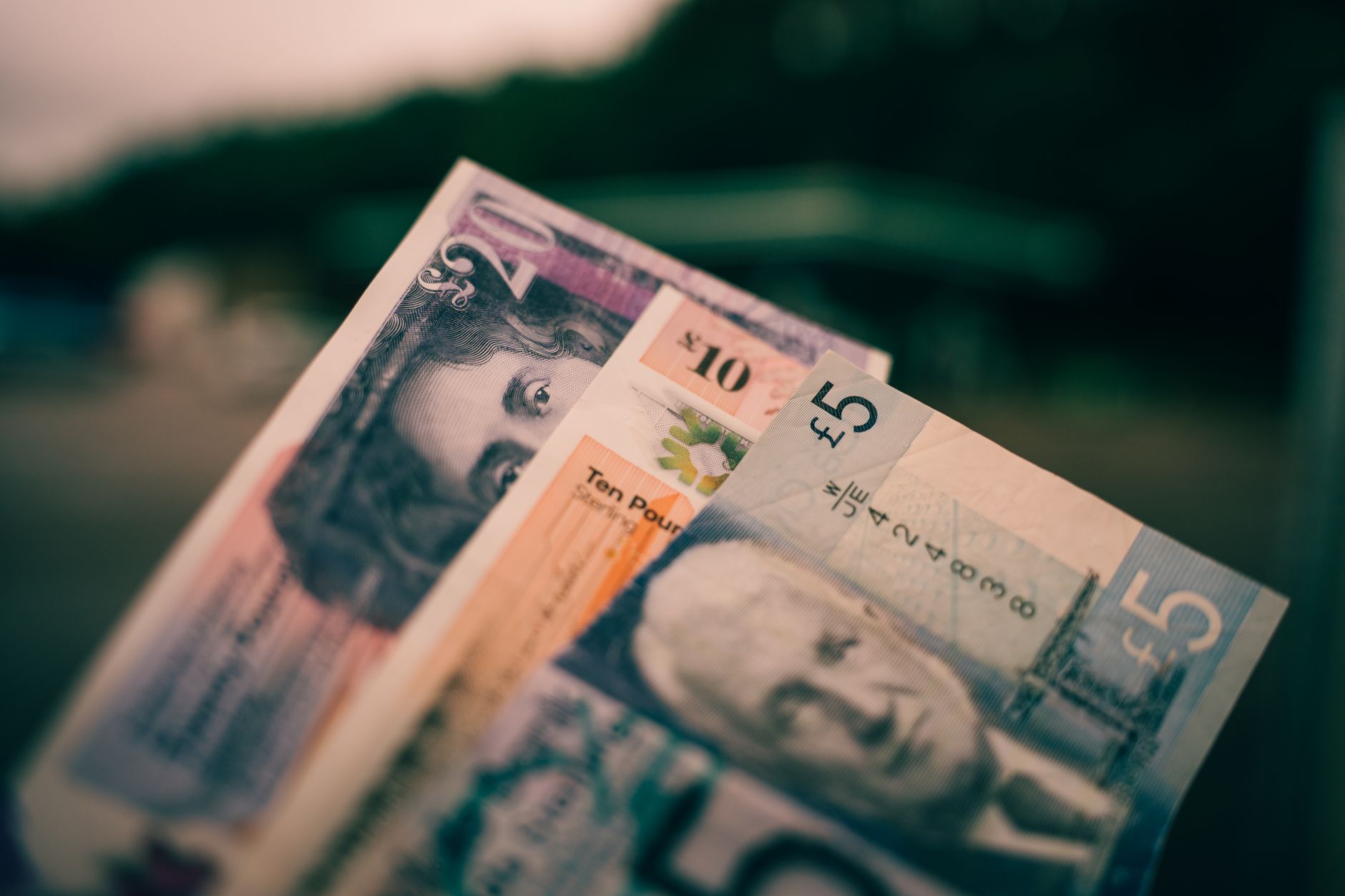 Cairo Budget Travel and Money Guide 2 Egyptian pound banknotes fanned out, the local currency travellers use across Cairo Egypt