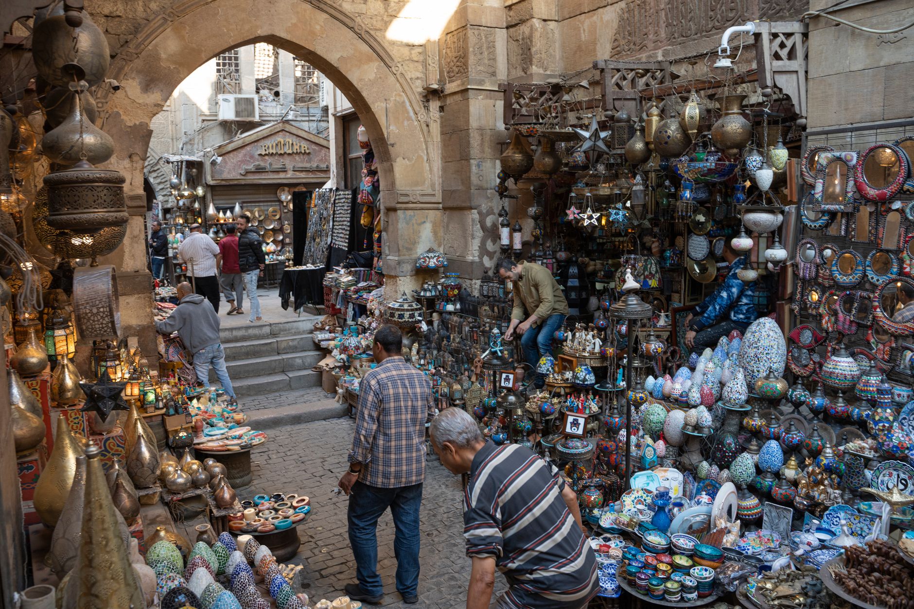 Gold cartouche pendants and pharaonic-motif jewellery on display in a Cairo gold souk in Egypt