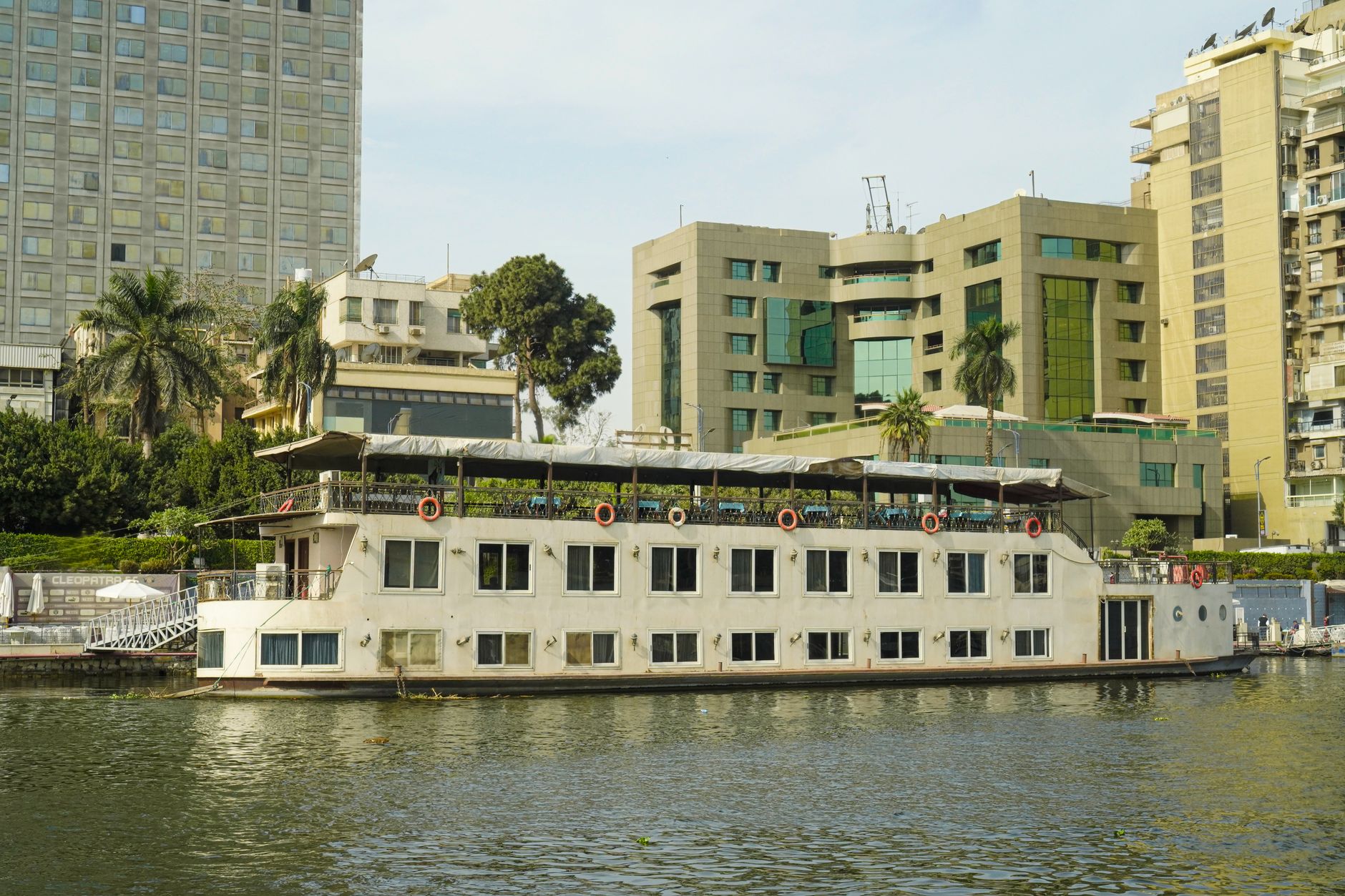 Illuminated Nile dinner cruise boat on the river at night in Cairo Egypt