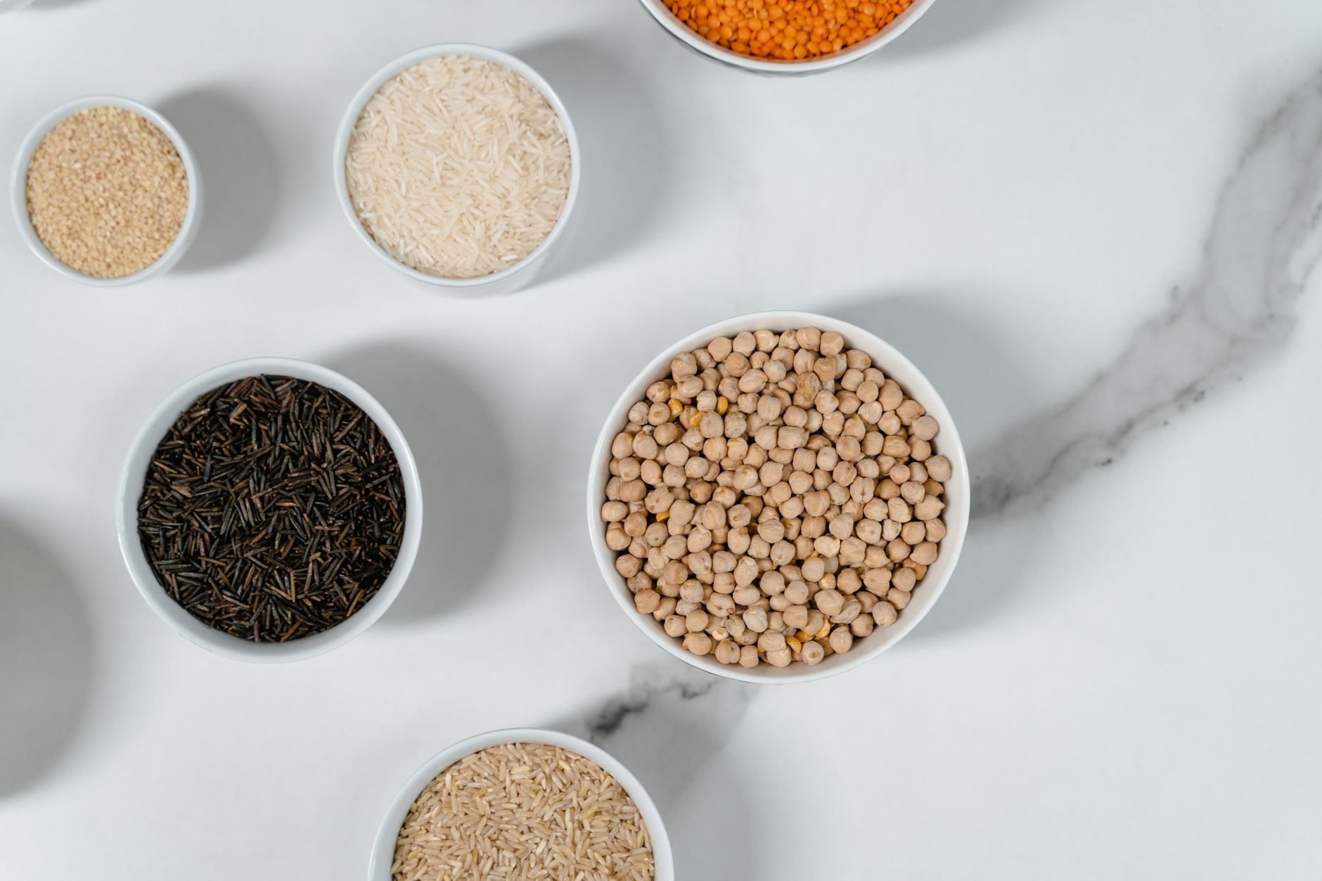 Koshary ingredients including brown lentils rice macaroni and chickpeas prepared in a Cairo kitchen