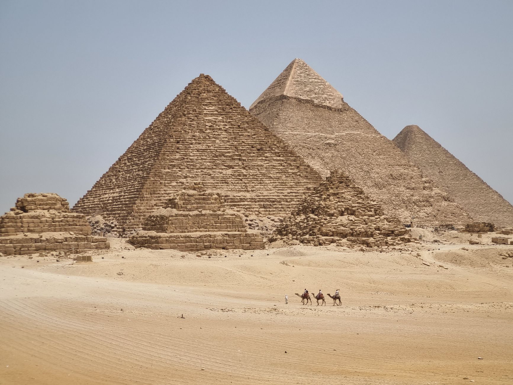 Pyramids of Giza History & Facts: What You Should Know 3 Panorama of the three Pyramids of Giza across the desert plateau near Cairo Egypt