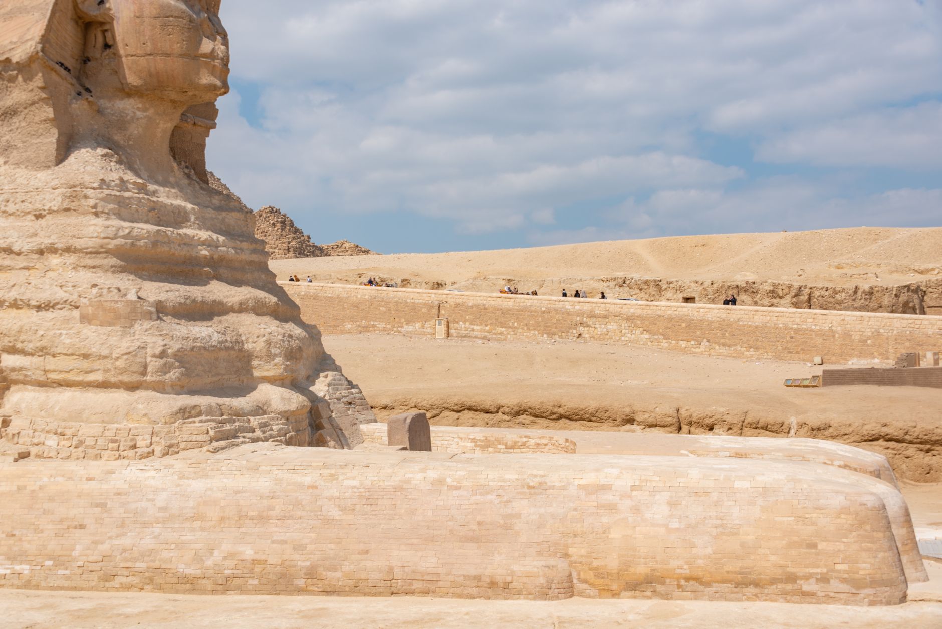 Pyramids of Giza viewed from a paved accessible viewpoint with the Sphinx in Egypt