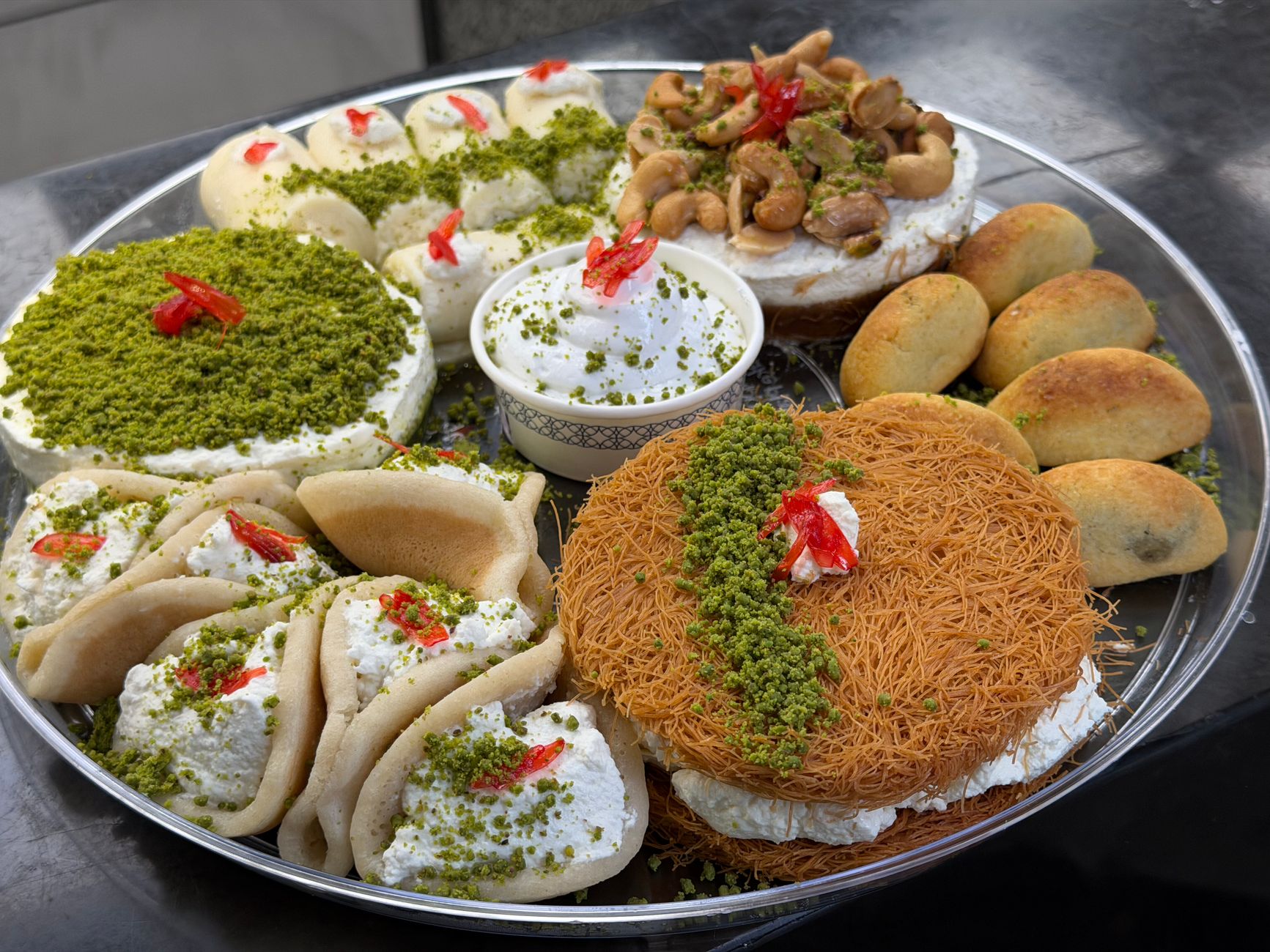 Ramadan Food in Cairo: Fasting & Feasting Guide 3 Qatayef and konafa Ramadan sweets in Cairo Egypt, fried pastry filled with nuts and cream soaked in syrup