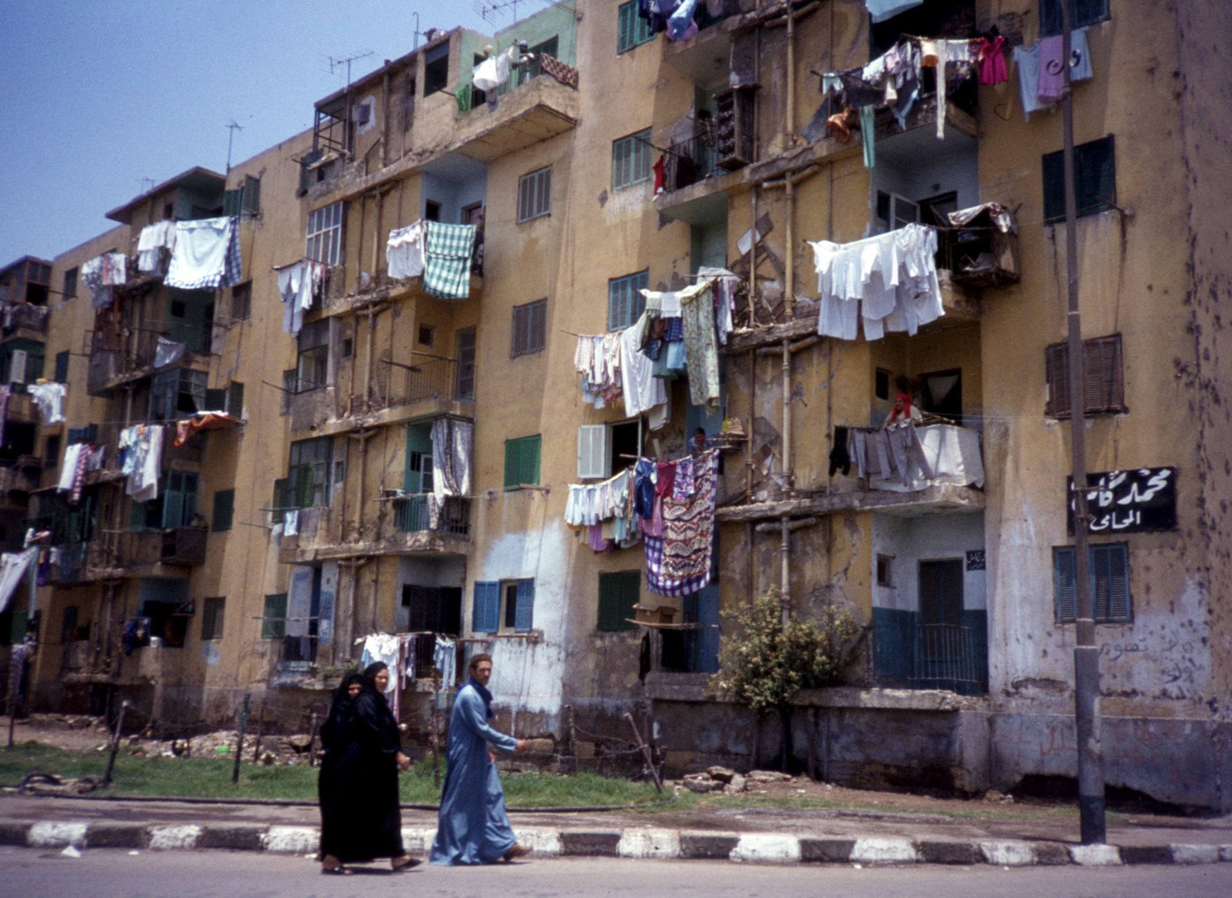 Residential neighbourhood street in Cairo, Egypt with apartment buildings and trees