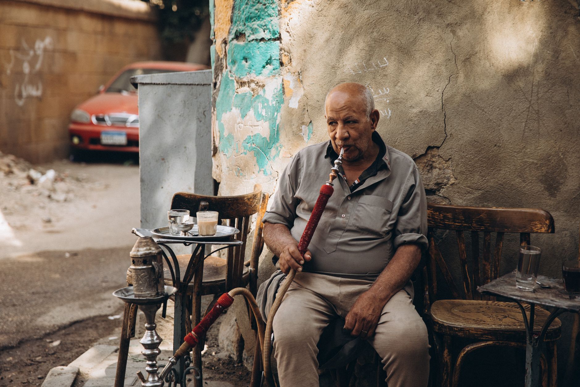 Solo traveler relaxing alone in a traditional Cairo cafe in Egypt