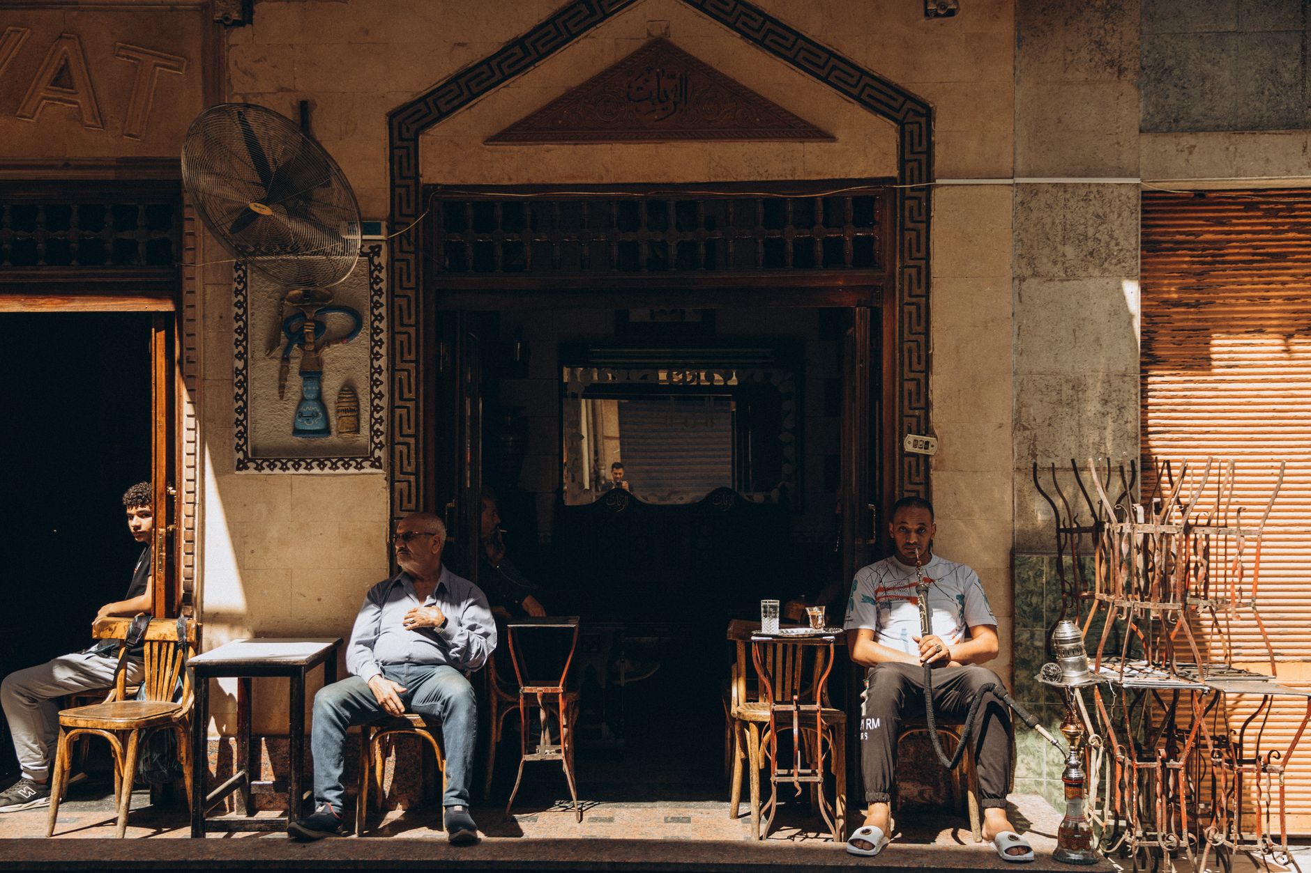 Traditional Cairo ahwa coffeehouse in Egypt with shisha pipes and copper coffee pots on the table