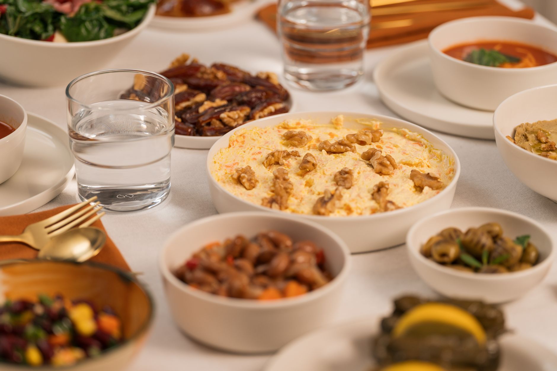 Traditional Ramadan iftar table in Cairo Egypt with dates, lentil soup and bread laid out before sunset