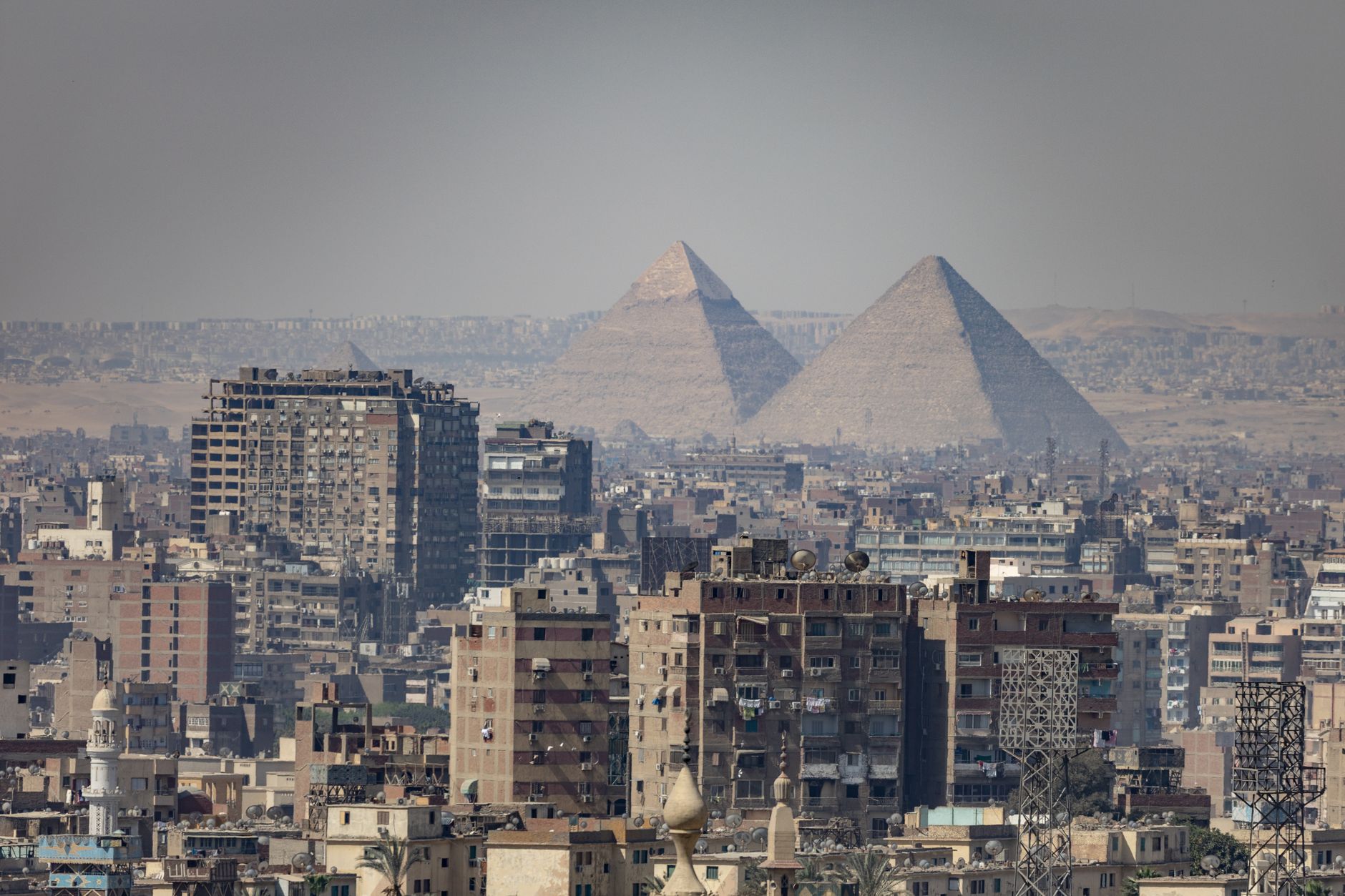 Best Neighborhoods in Cairo for Tourists: Location Guide 4 View of the Giza Pyramids from a hotel rooftop in the Giza neighbourhood of Cairo