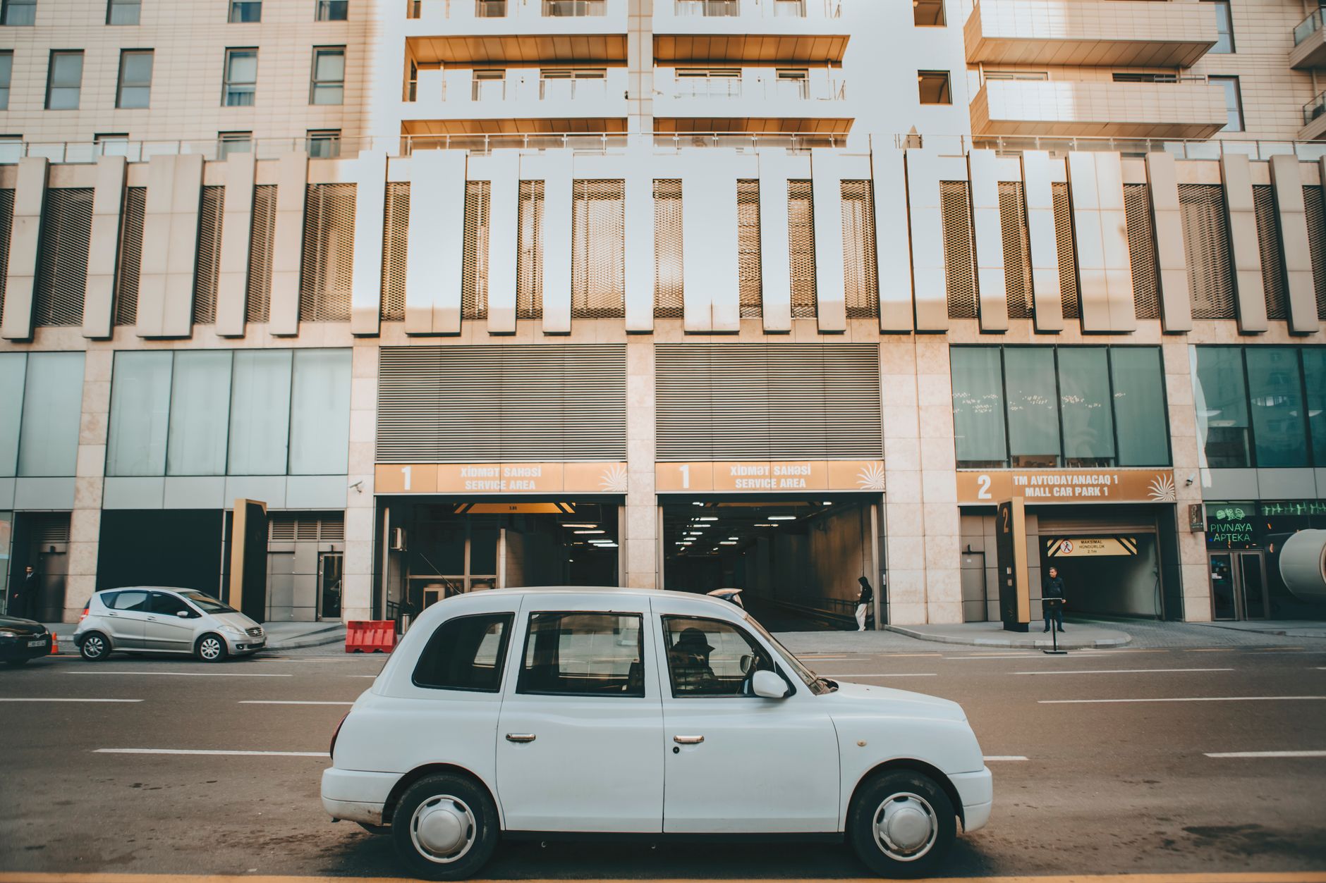 Getting Around Cairo: Transportation Guide 4 White metered taxi on a busy street in central Cairo Egypt