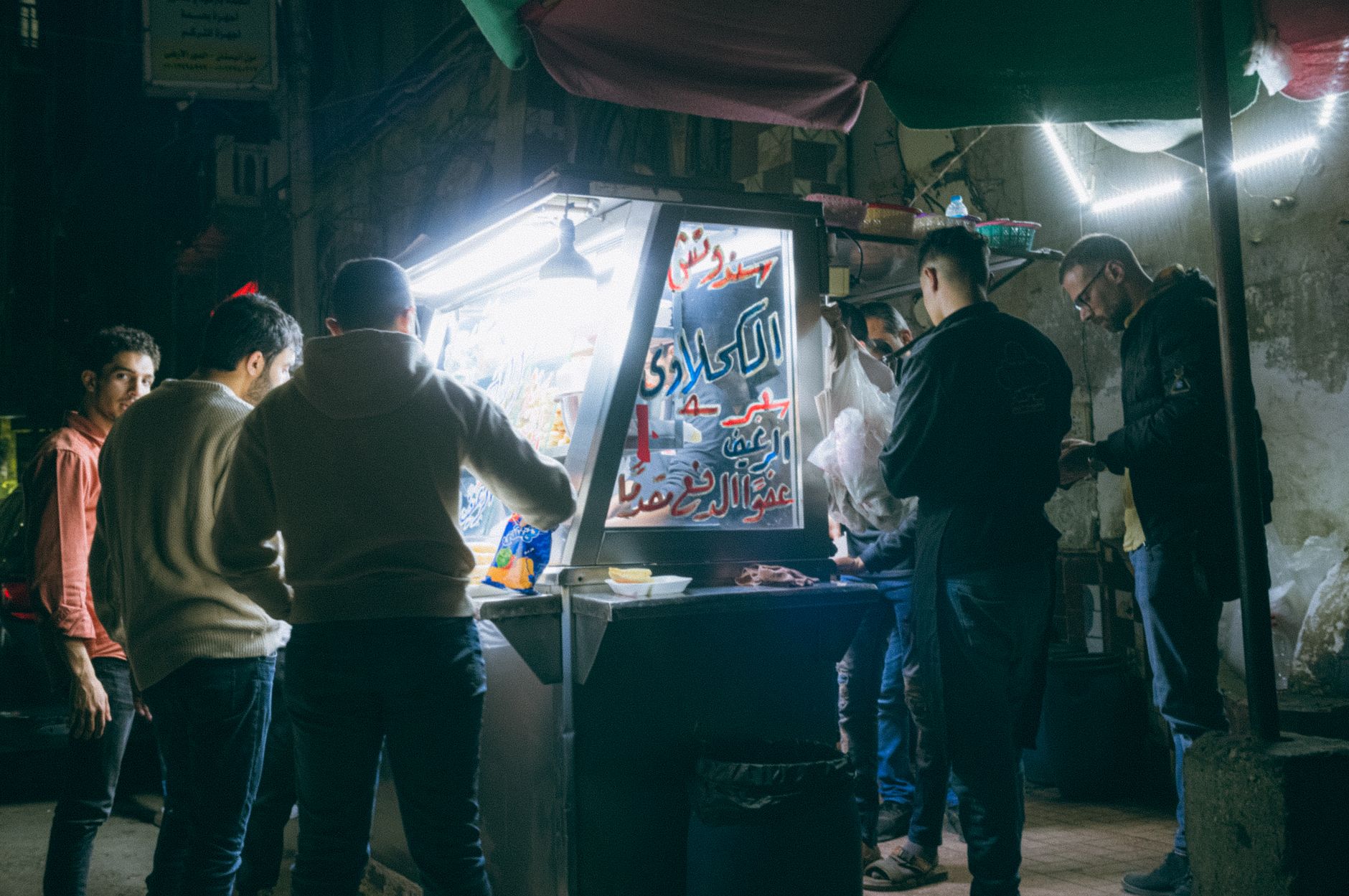 Cheap Eats in Cairo: Budget Food Guide 4 Busy Downtown Cairo street food stall at night