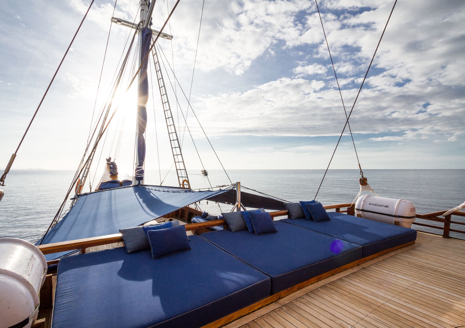 Sunset Nile Cruise Cairo: Perfect Evening Experience 4 Felucca deck cushions and lateen sail against evening sky