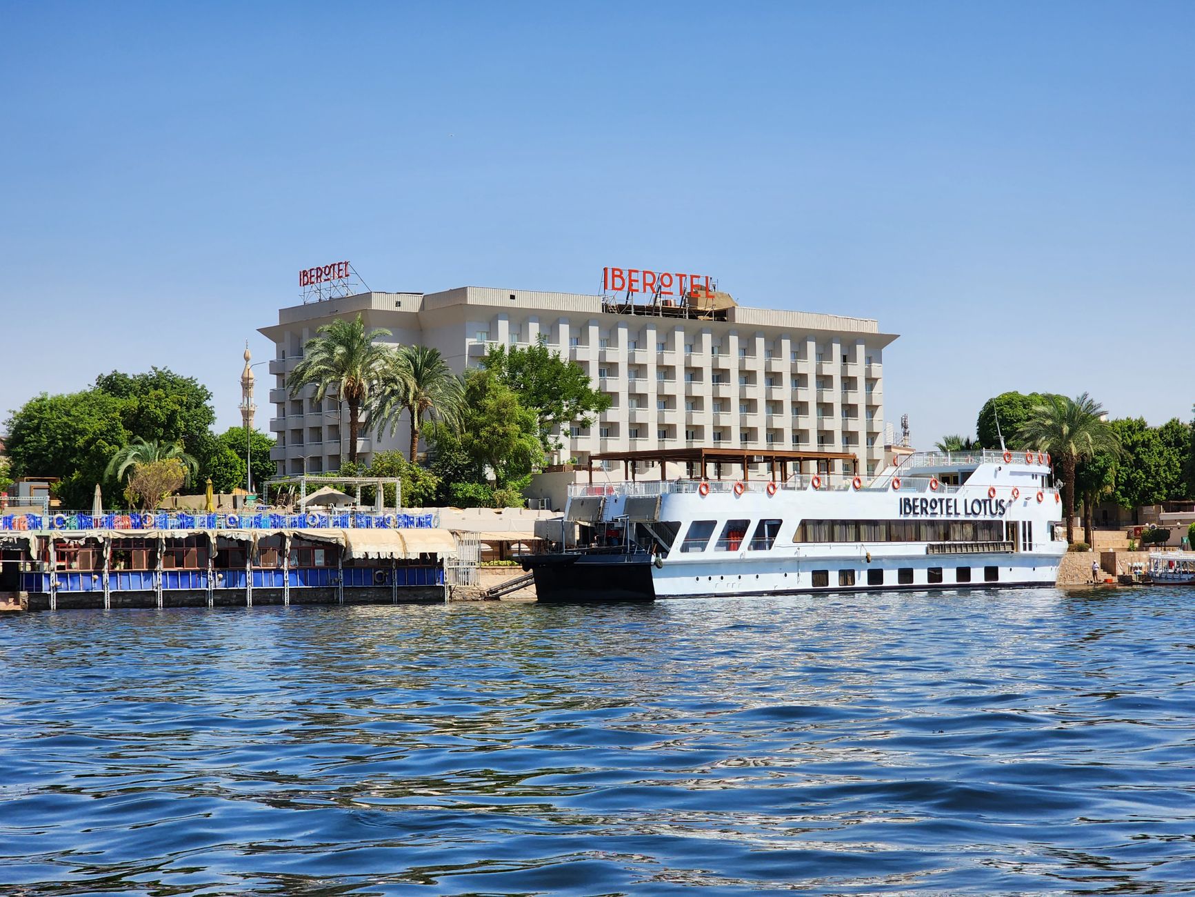 Nile Dinner Cruise Cairo Guide: Evening Dining 2 Illuminated Nile dinner cruise boat at night in Cairo