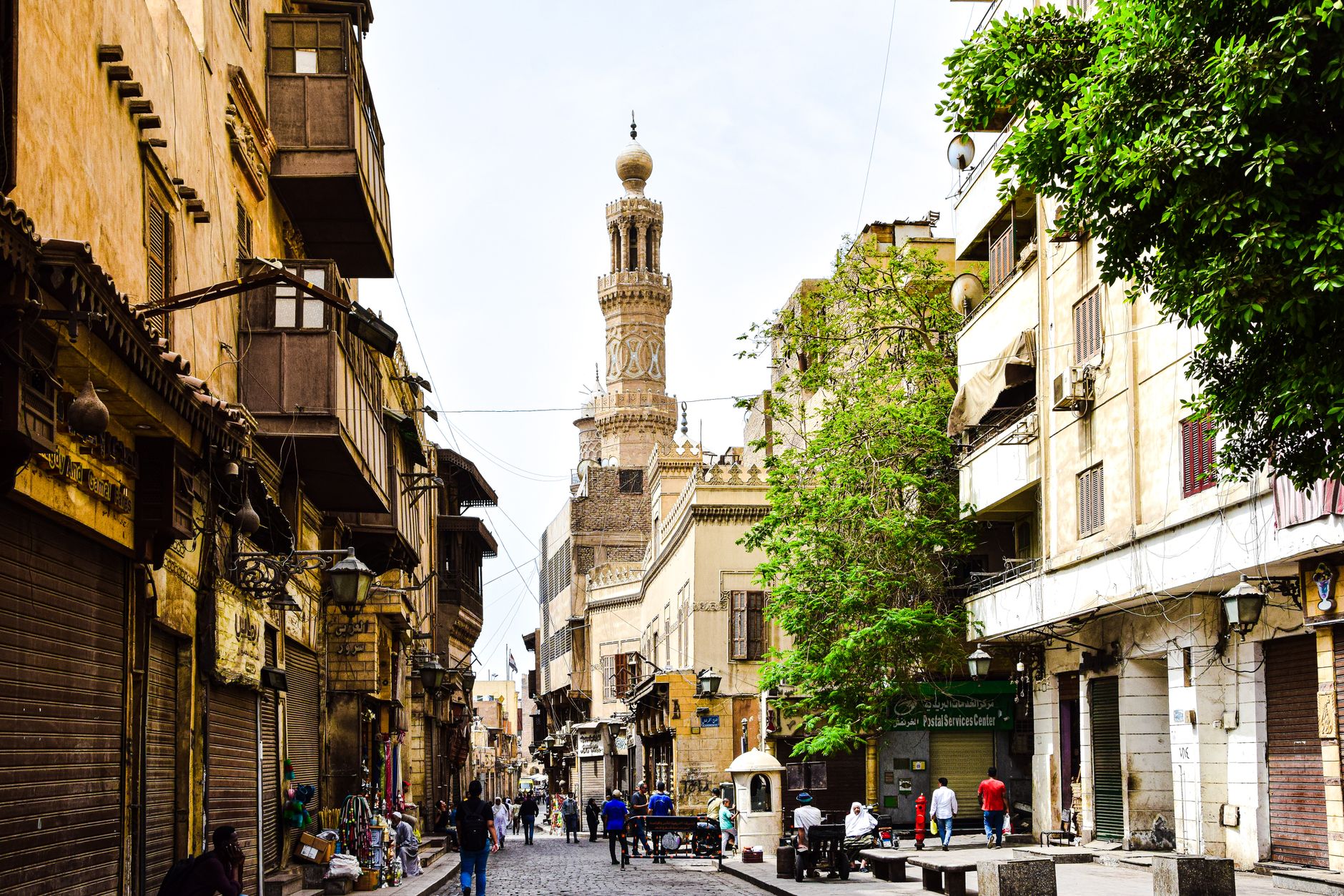 Cairo Student Travel: Discounts & Budget Tips 5 Students walking a lit medieval street in Islamic Cairo