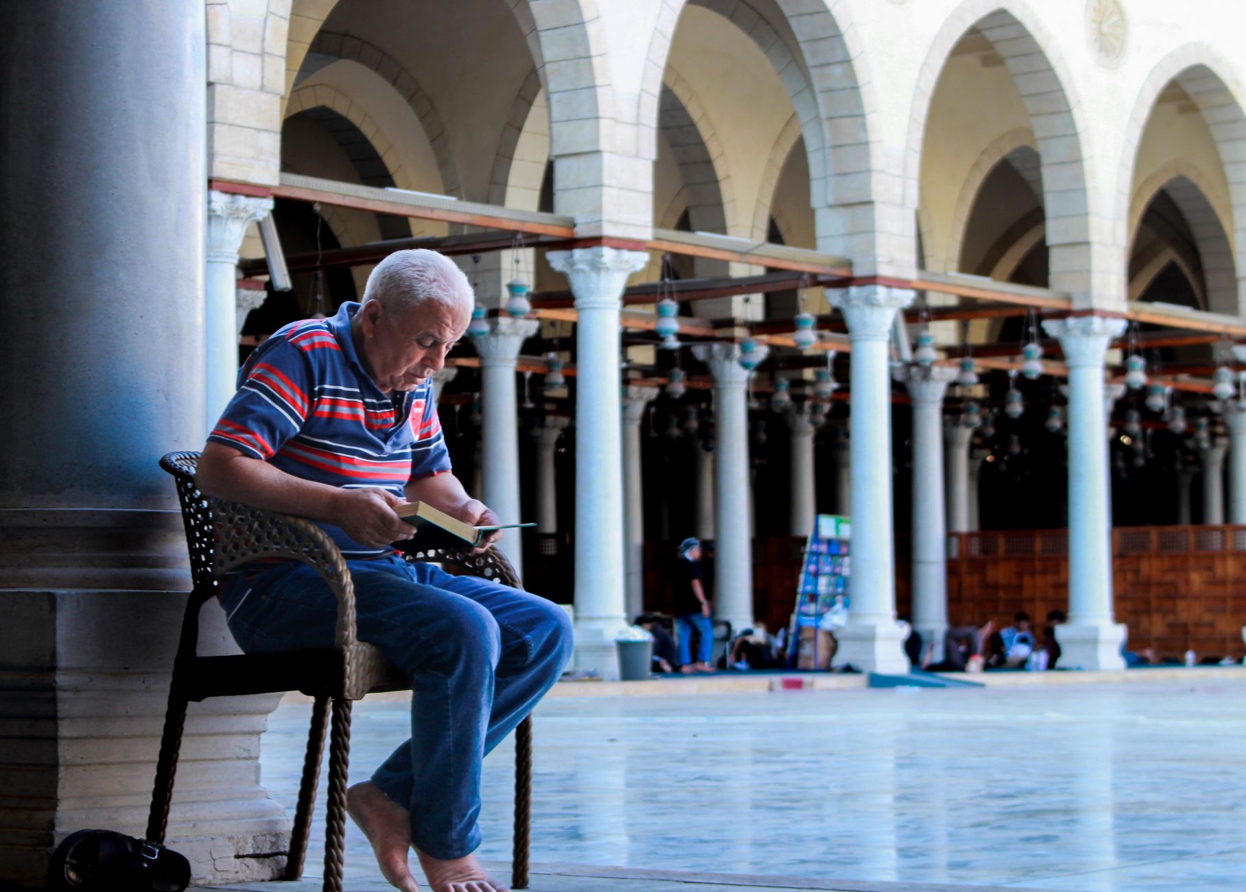 Best Nile Cruise Companies Cairo: Tour Operators 4 Tourist reading a booking voucher on a Cairo hotel terrace