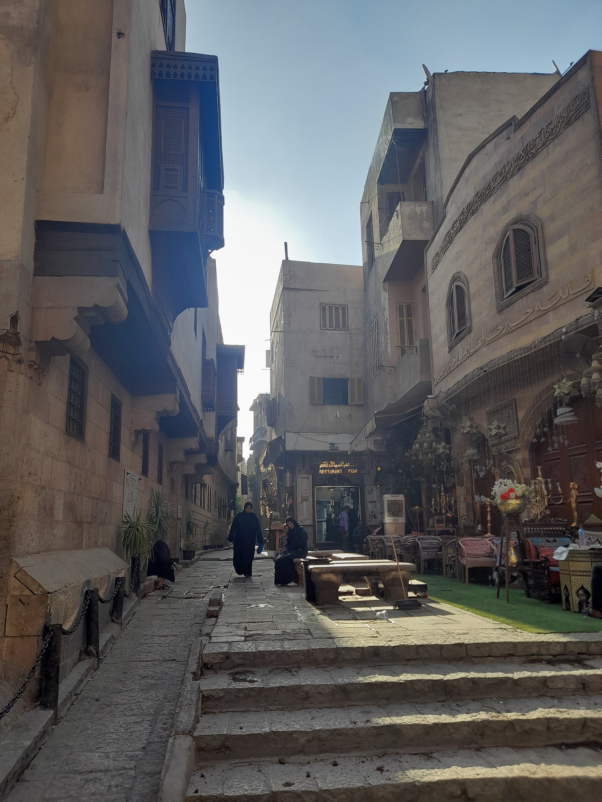 Cairo Itineraries: Day-by-Day Plans for 1 to 7 Days 4 Medieval alley in Islamic Cairo with carved mashrabiya balconies and shopfronts, viewed from stone steps