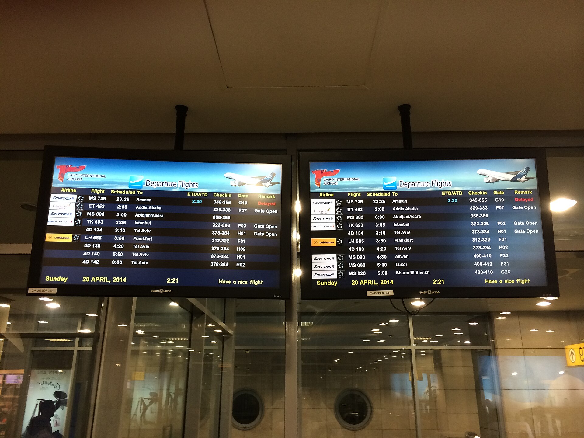 Cairo International Airport (CAI): Complete Traveler Guide 5 Two departures screens at Cairo International Airport in the early hours, listing EgyptAir flights to Luxor, Aswan and Sharm el-Sheikh alongside Lufthansa, Turkish Airlines and Ethiopian departures