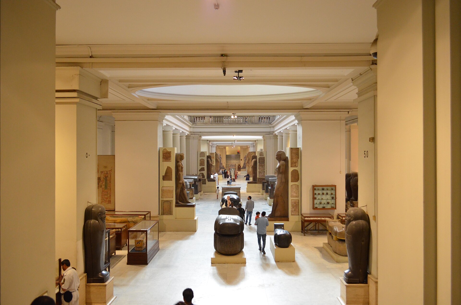 Grand Egyptian Museum vs Egyptian Museum Tahrir: Which Should You Visit? 3 The main hall of the Egyptian Museum at Tahrir lined with sarcophagi, statues and wooden display cases