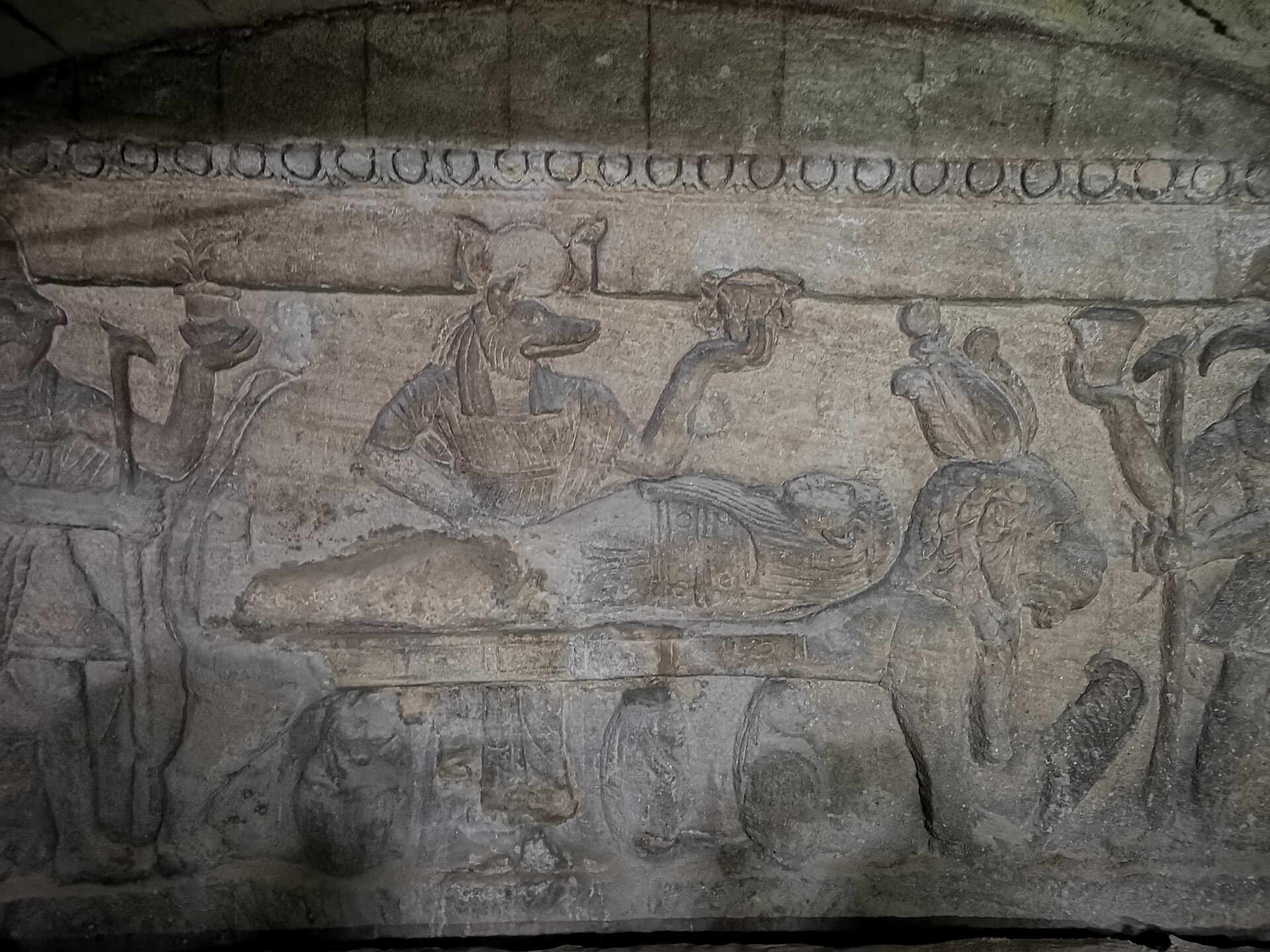 Cairo and Alexandria Itinerary: Five Days, Two Cities 4 A carved relief in the Catacombs of Kom el-Shoqafa showing the jackal-headed god Anubis tending a mummy laid on a lion-shaped funerary bed