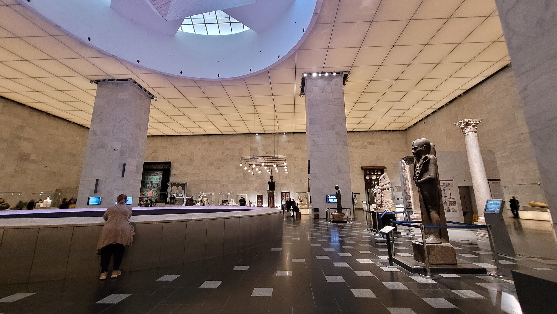 National Museum of Egyptian Civilization and the Royal Mummies 2 The central hall of the National Museum of Egyptian Civilization with marble piers, a circular oculus and displays around a curved balustrade
