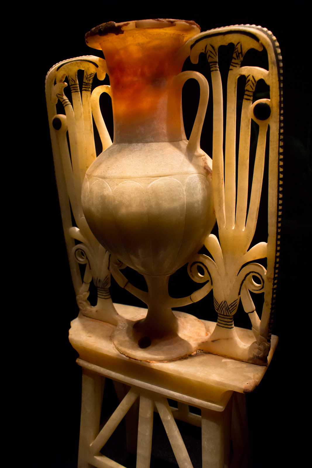Tutankhamun Galleries at the Grand Egyptian Museum: What You Will See 3 Carved alabaster unguent vase from Tutankhamun's tomb with openwork lotus and papyrus supports